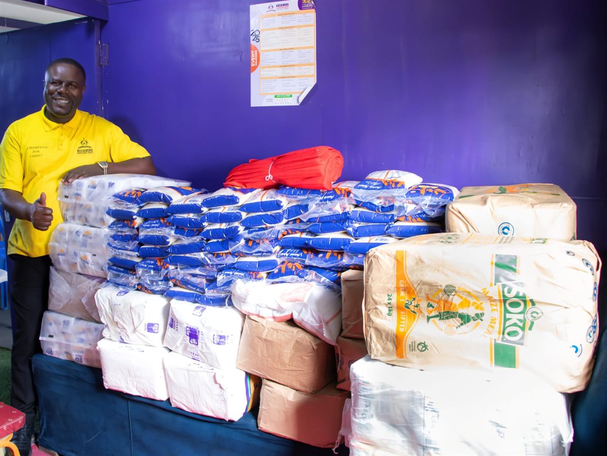 Families receiving food gift packs through Neema Operations
